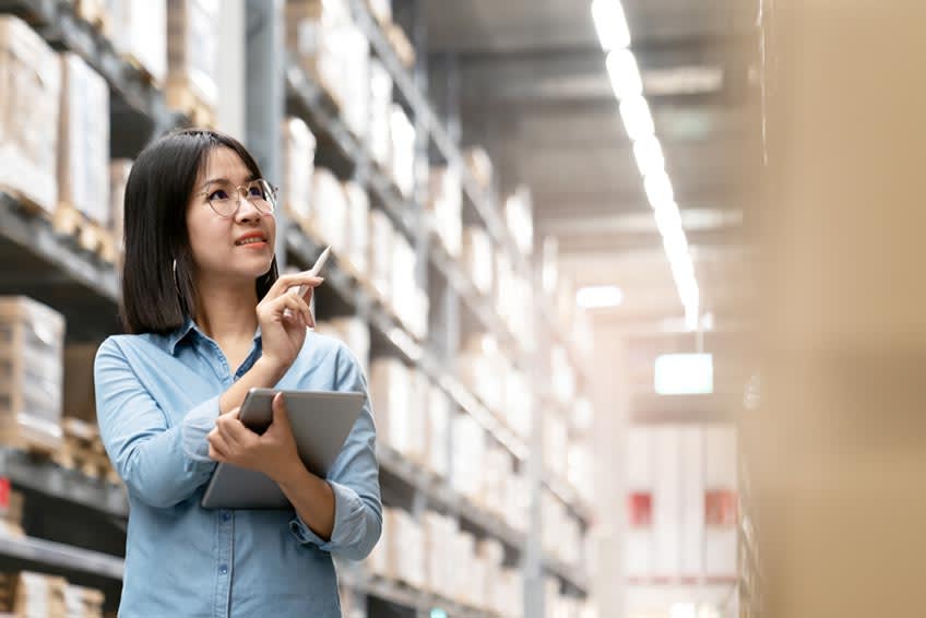 female workhouse worker checking inventory