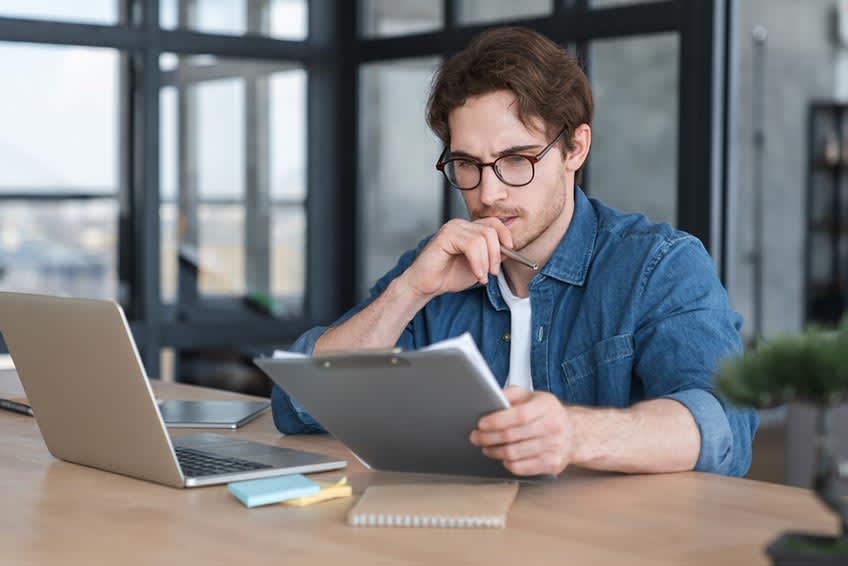 Young CEO preparing forecasting and data-driven budgeting report