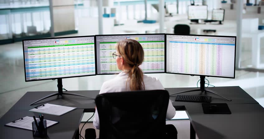 Financial employee for oil company checking efficiency reports