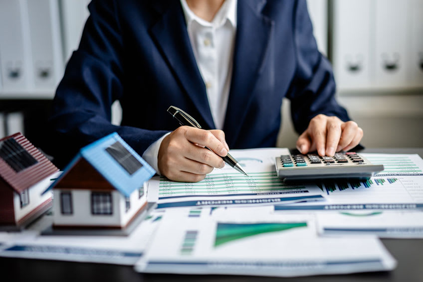 Outsourced accountant working on finance statements for real estate business