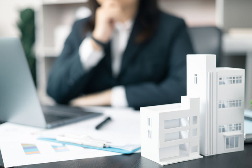 background of real estate finance expert searching for outsourcing companies nearby