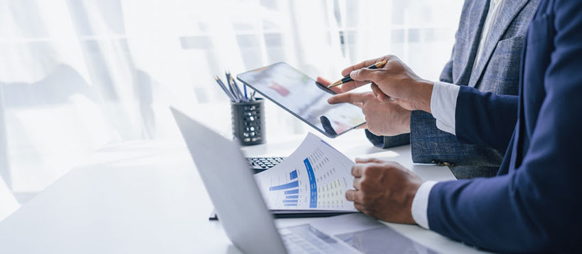 CFO and VP reviewing accounts payable process to identify challenges