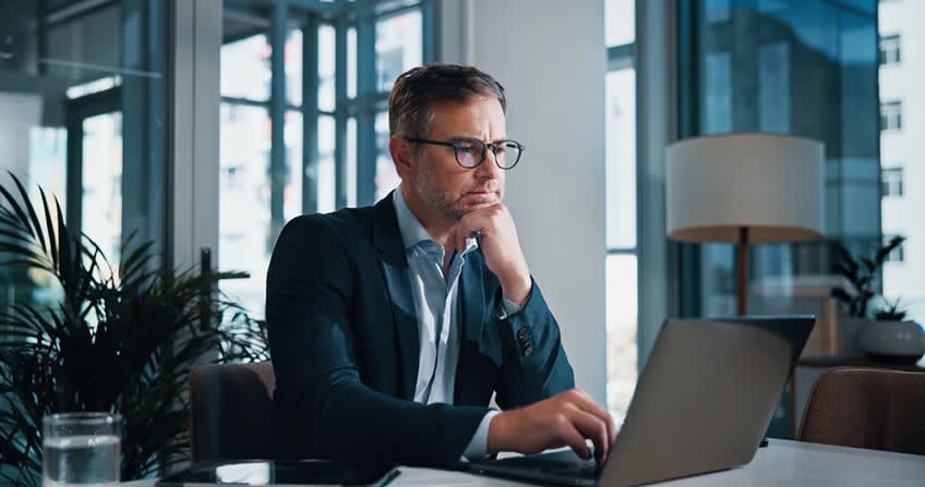 Finance director reviewing new compliance literature