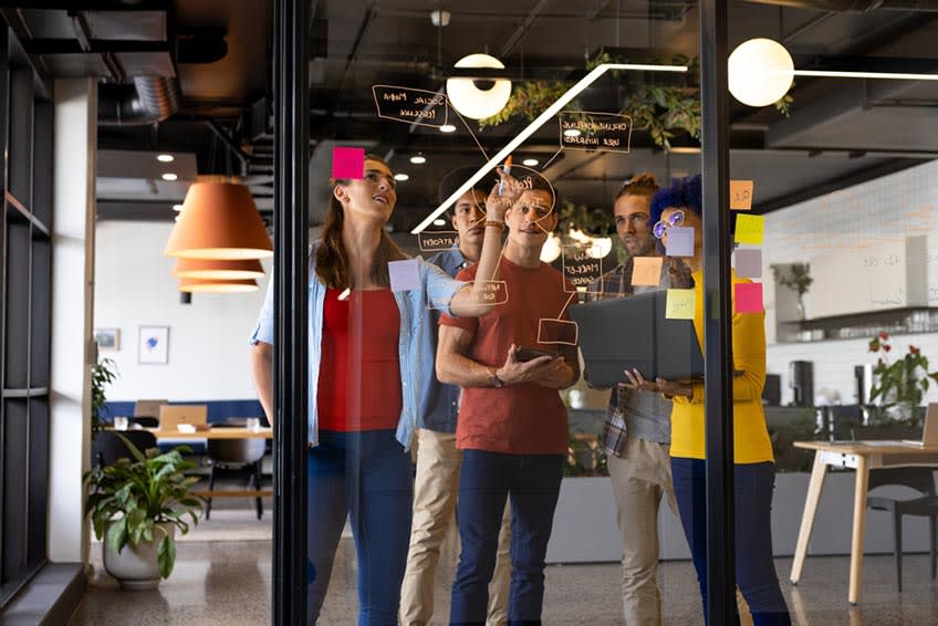 Nonprofit executive team reviewing structure and roles during informal meeting