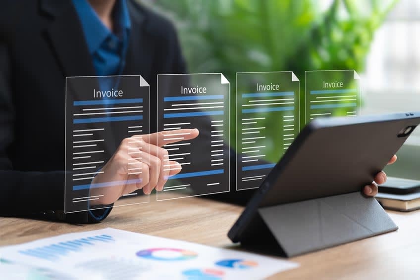 financial staff reviewing AI results from their invoicing process