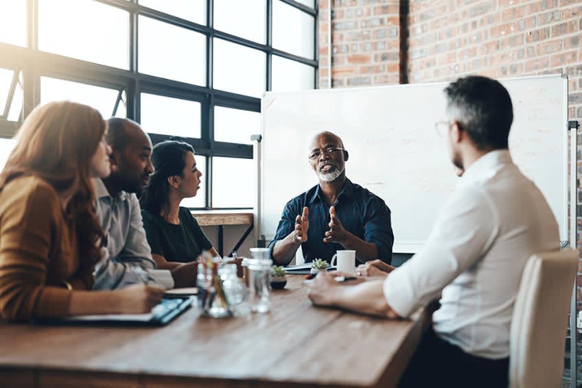 Accounts payable provider in meeting going over the services they offer