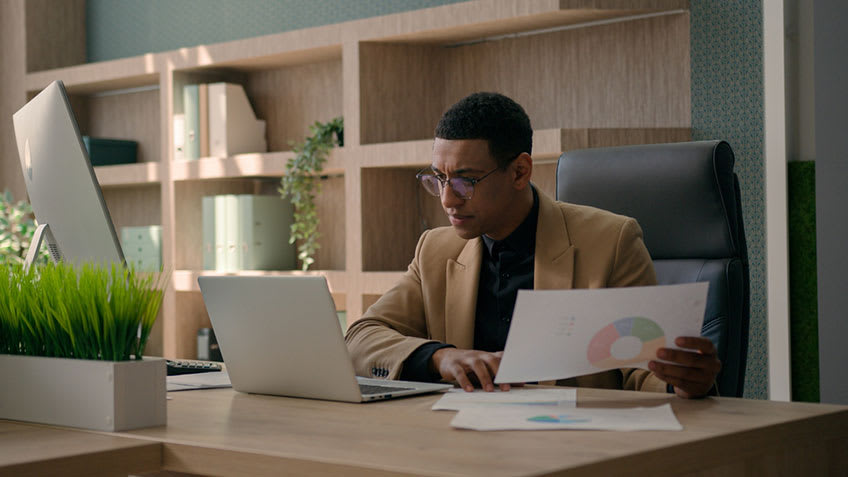 Business owner trying to fix bookkeeping mistakes made by his team