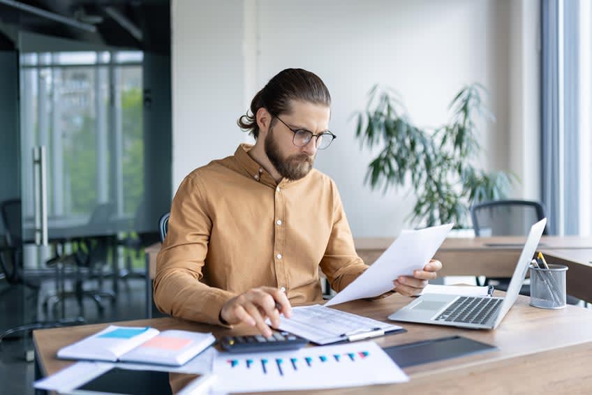 CFO calculating savings of bookkeeping outsourcing