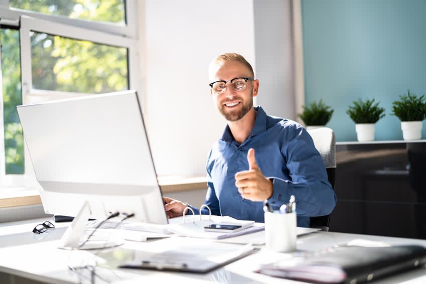 In-house bookkeeper smiling at the camera