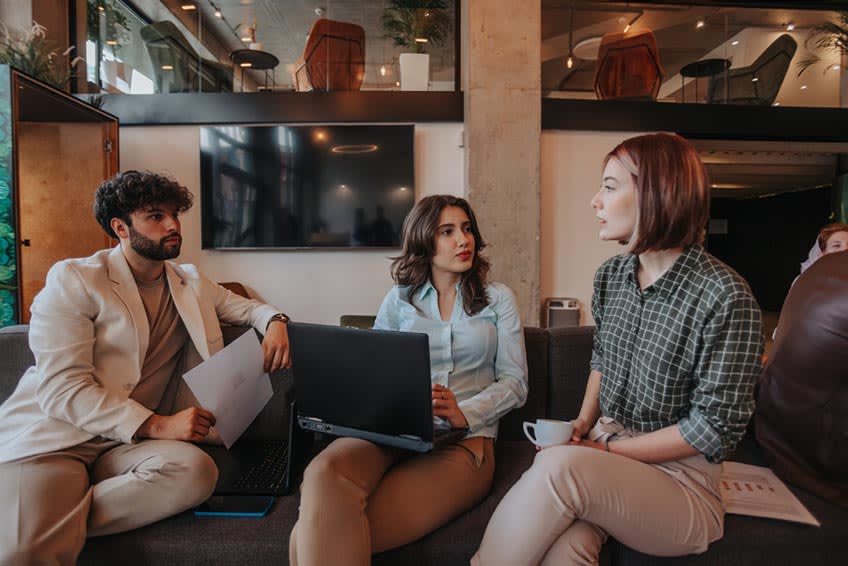 CFO and CEO meeting with consultant on when the right time to hire a finance BPO provider is