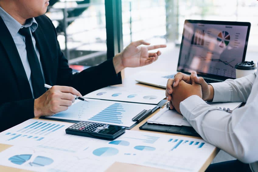 Accounting BPO provider and CFO going over custom outsourcing solution costs