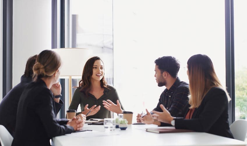 Finance team discussing the reasons why AI can't replace humans