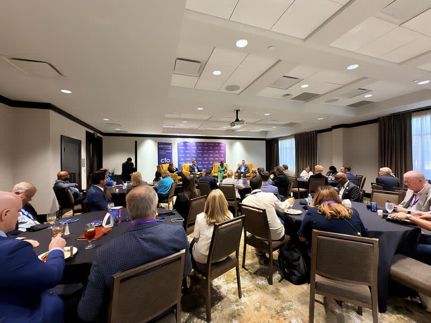 CFO Leadership Live attendees enjoying lunch while listening to the panel