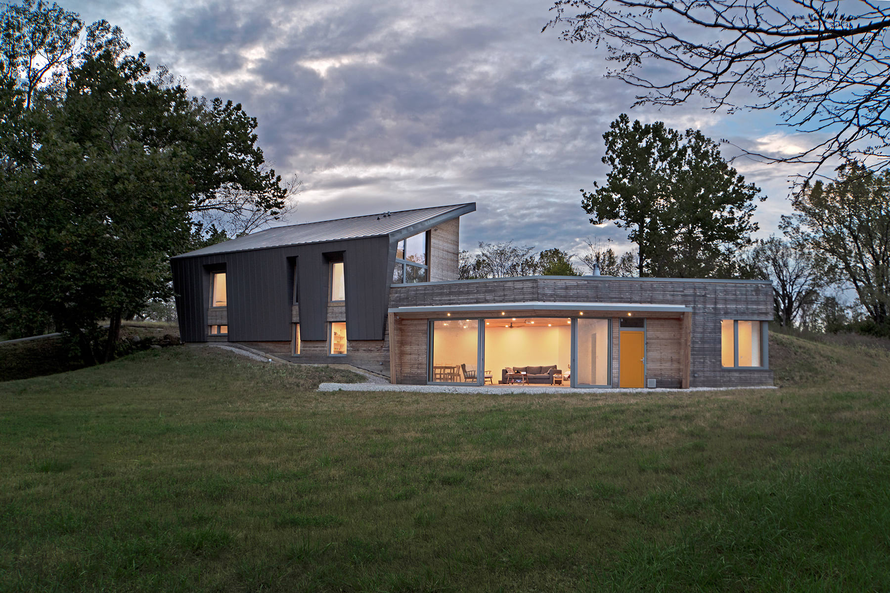 A modern building on a patch of grass