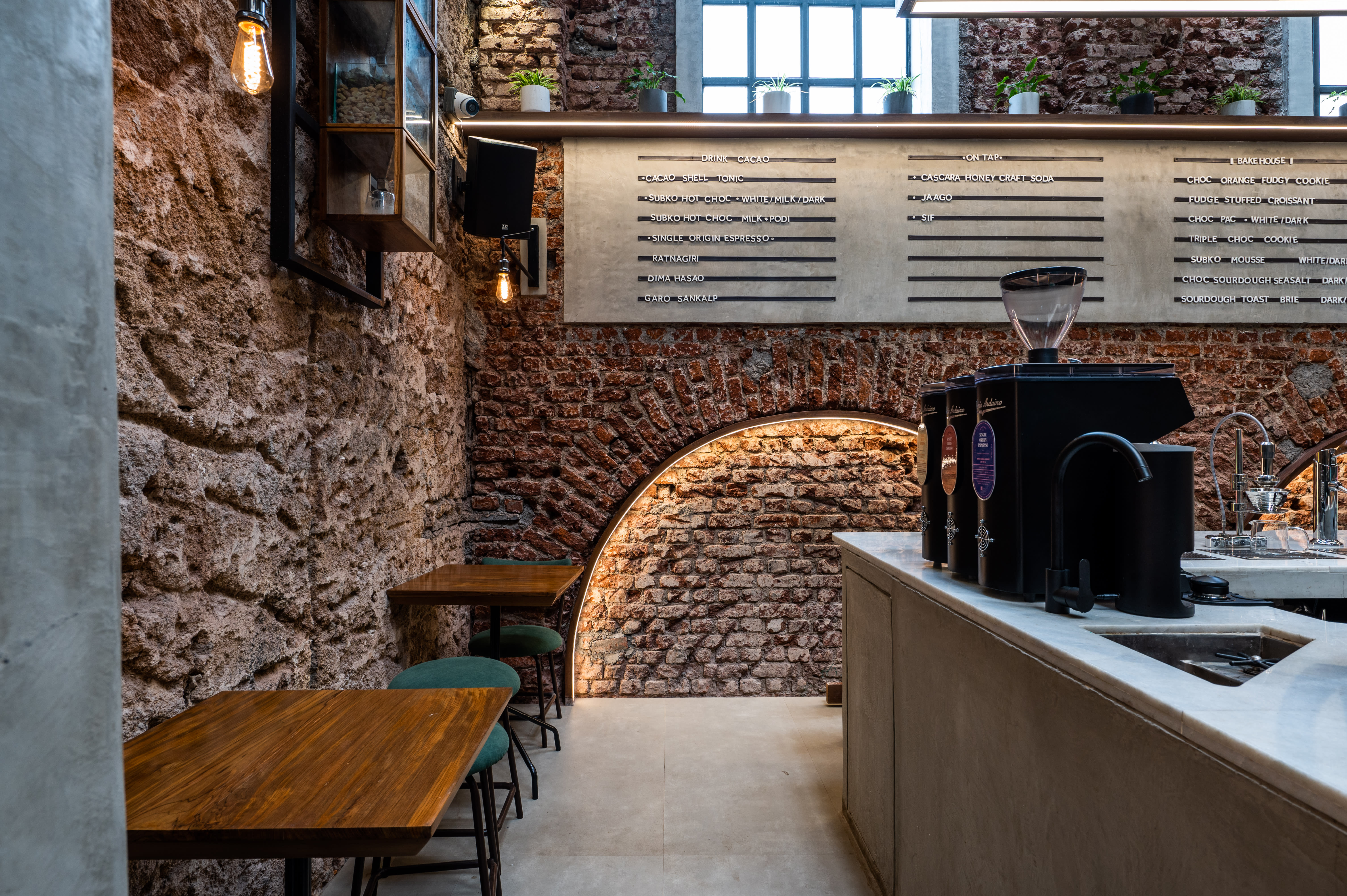 cafe area showing exposed brick walls in the seating area