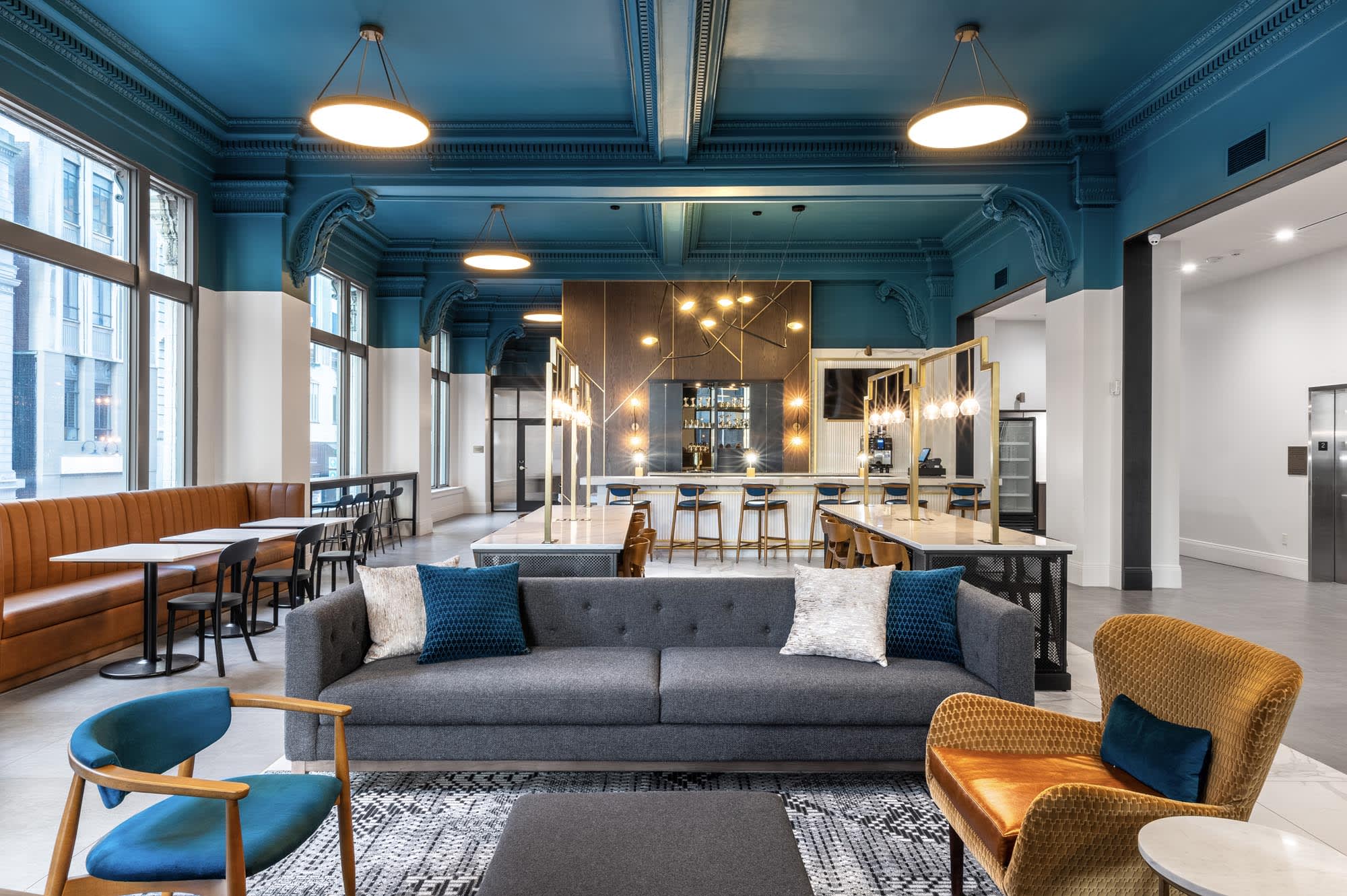 modern interiors of the Ingalls building with a bright blue room and furniture