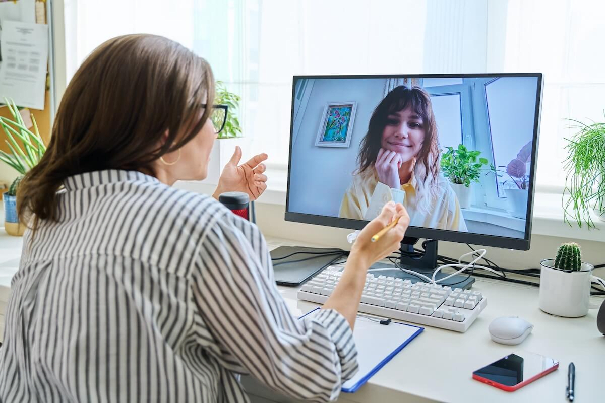 Doctor talking to her patient online
