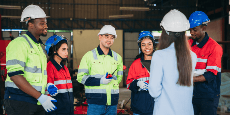 Group of workers meeting on the factory floor