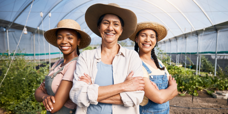 A group of farm workers smiling.