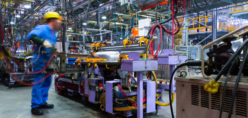 Workers in an auto manufacturing plant.