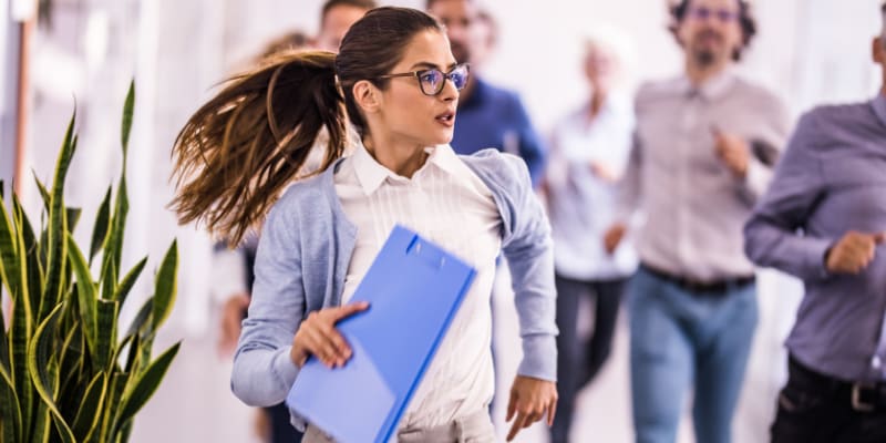 Woman running in an office.