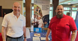WSPS consultant with a conference attendee.