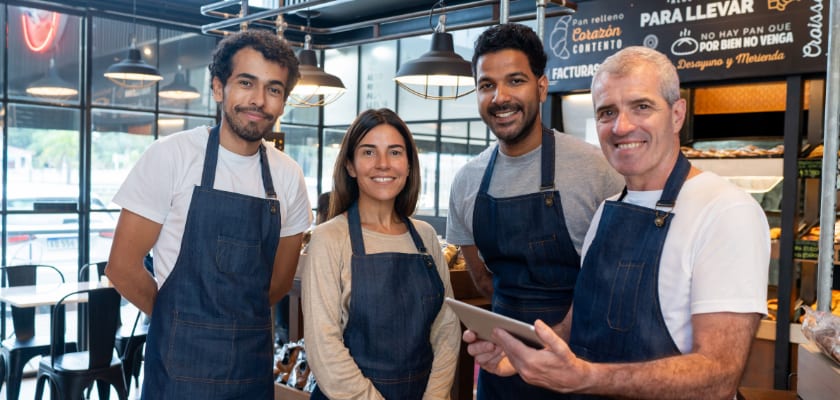 Group of employees being trained at a cafe.