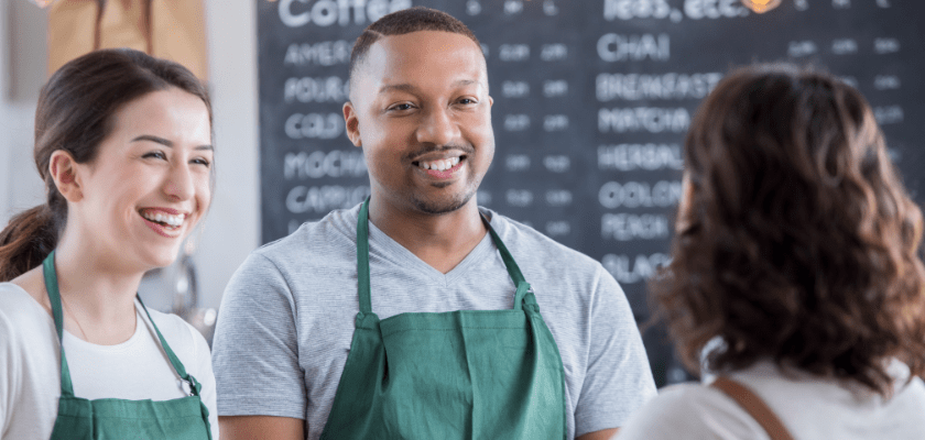 Group of workers in a restaurant being trained.