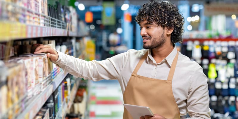 Retail worker stocking shelves