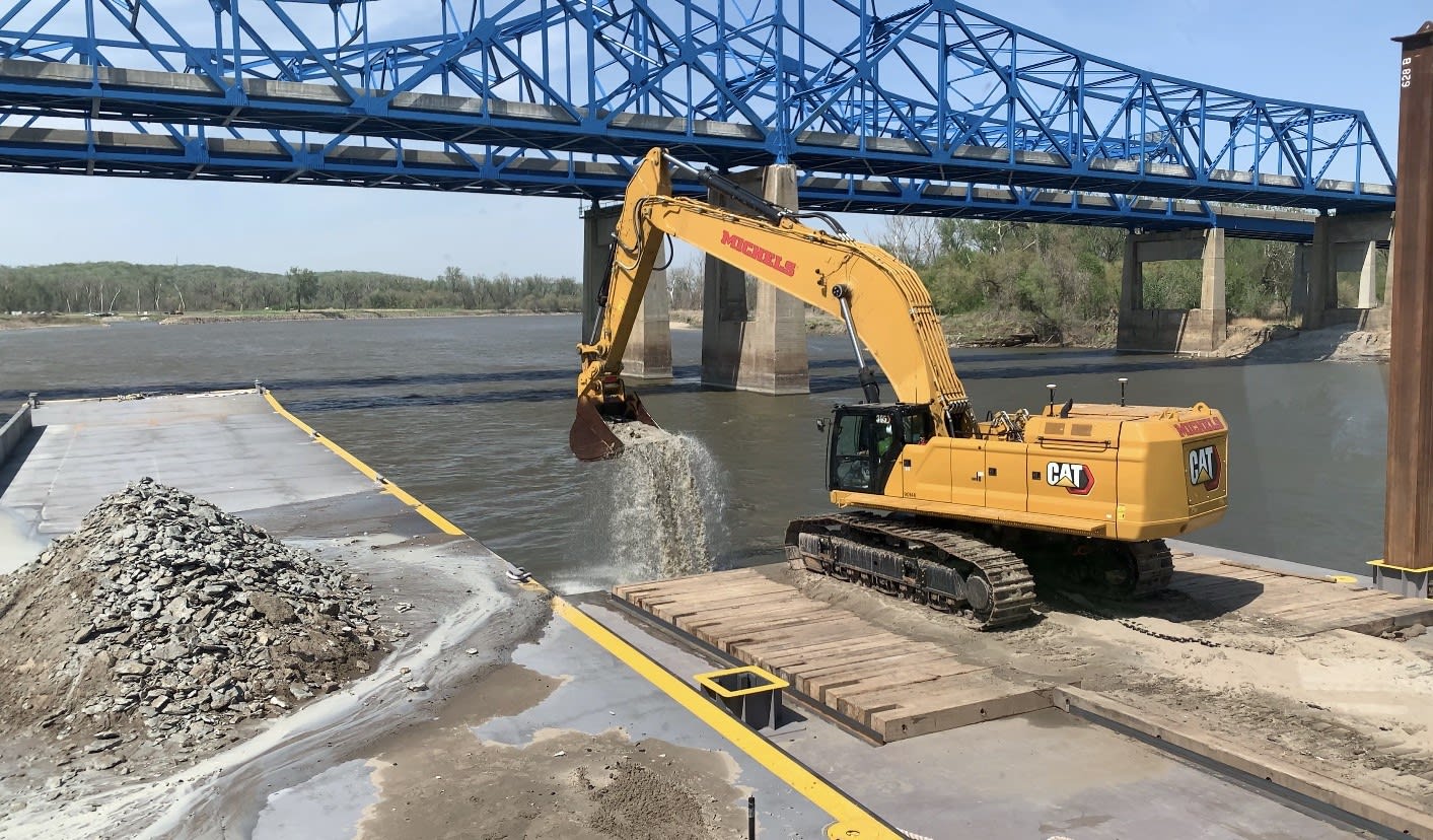 Excavator removing material on Missouri river