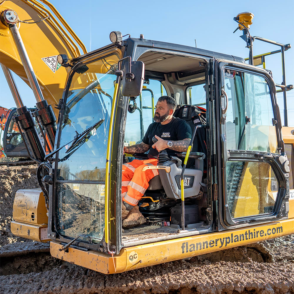 Lloyd Peckham and an excavator with Trimble Earthworks
