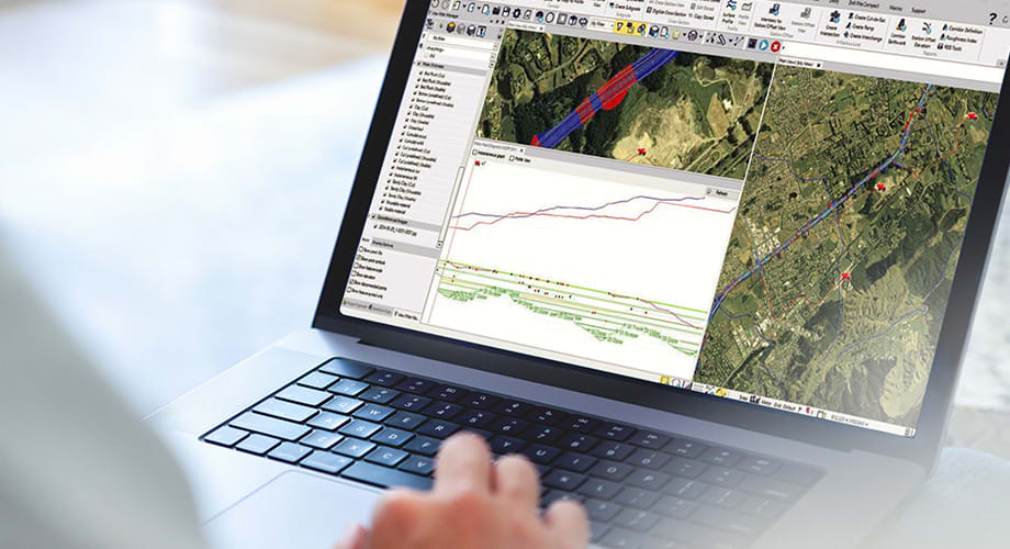A laptop screen displaying construction technology software, a key component of construction technology subscriptions