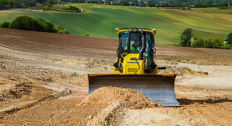 A machine with Trimble machine control is moving dirt on a jobsite.