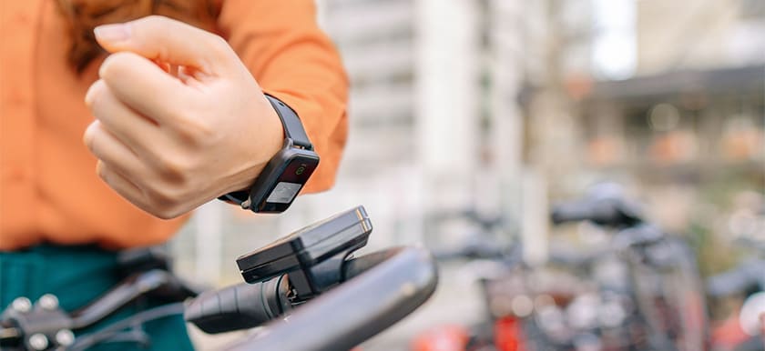 Customer using smartwatch to complete a contactless payment