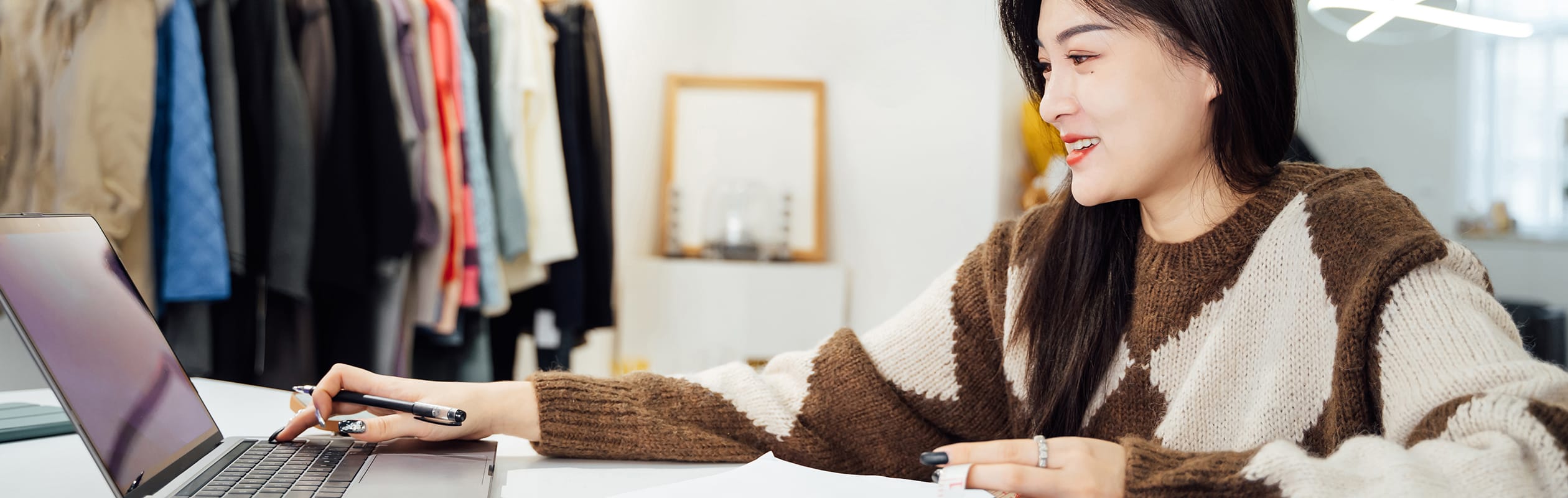 Woman managing an online store or e-commerce business on her laptop