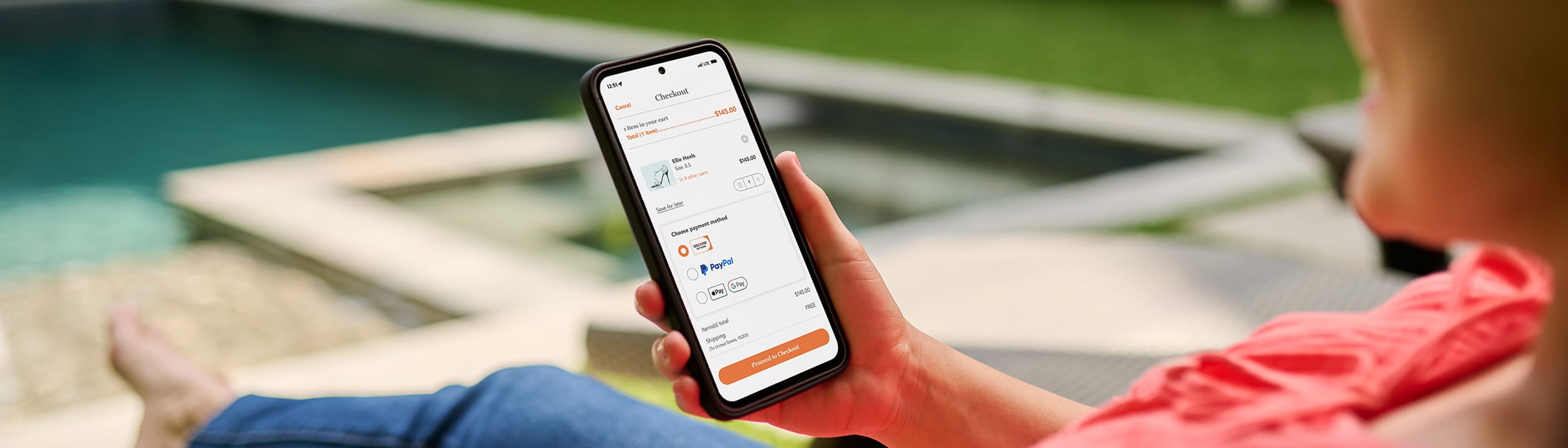 Person shopping on mobile while sitting outside