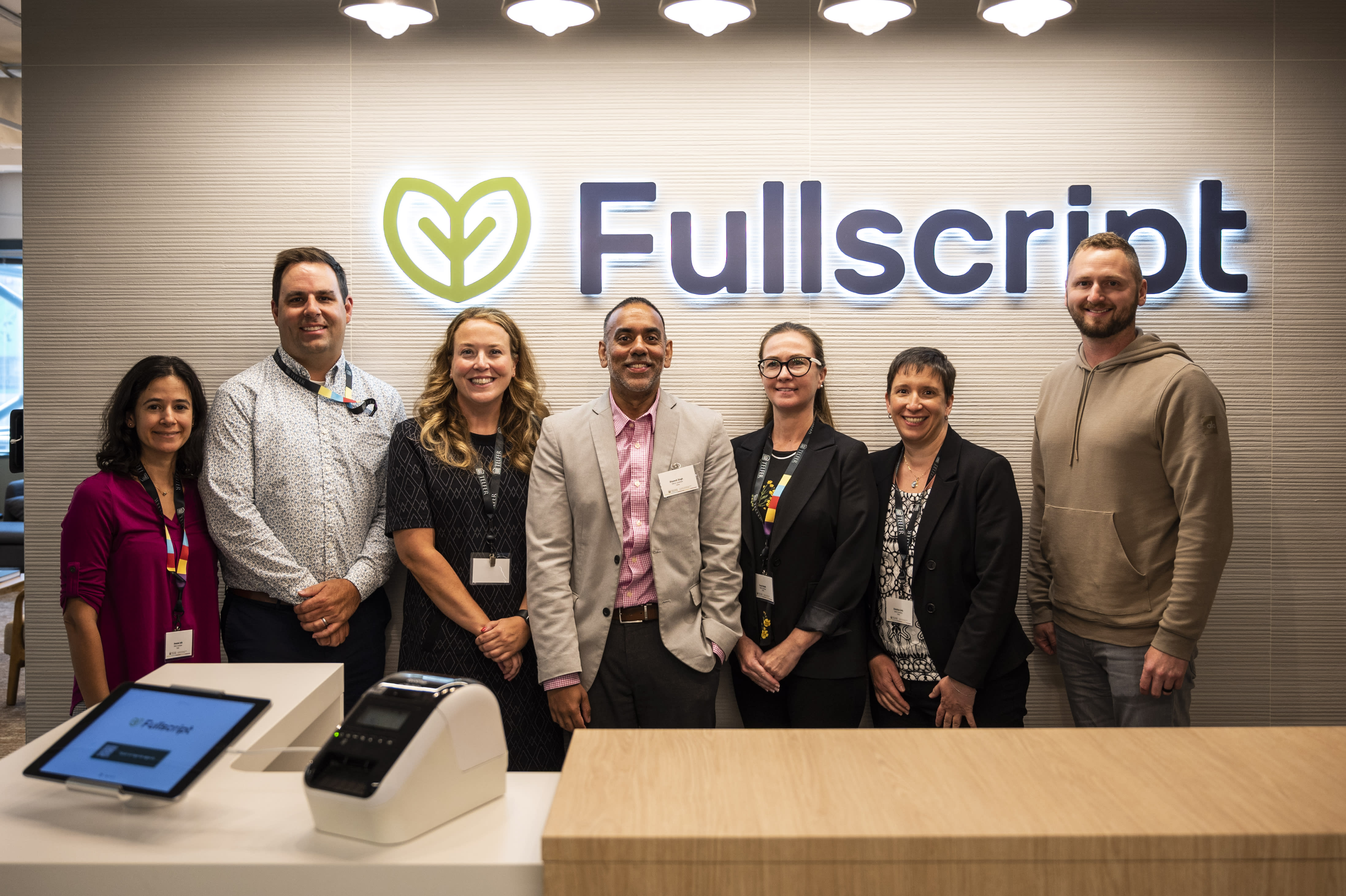 Telfer EMHA Class of 2024 graduates smiling with Kyle Braatz, CEO of Fullscript. 