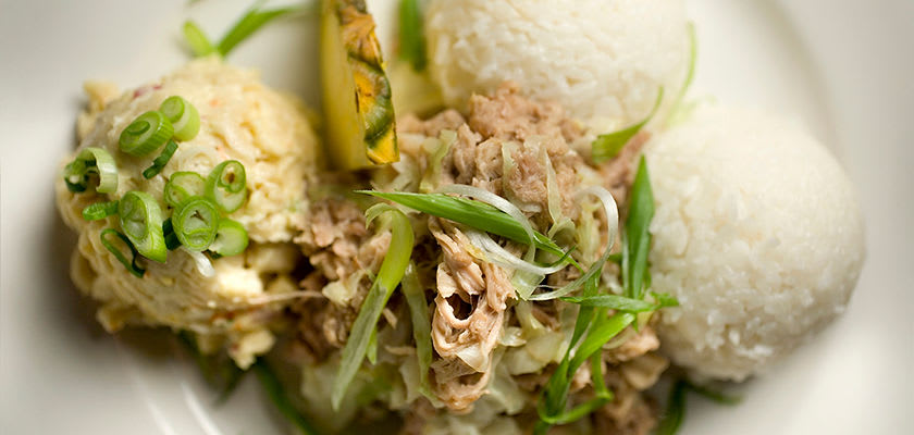 Kālua pork kalua pork served with rice and pineapple slice