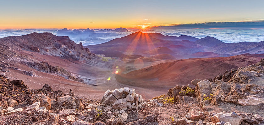 view of sun rising from haleakala volcano