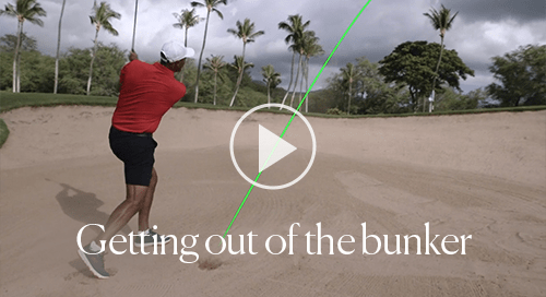 Pro golfer hitting out of a bunker