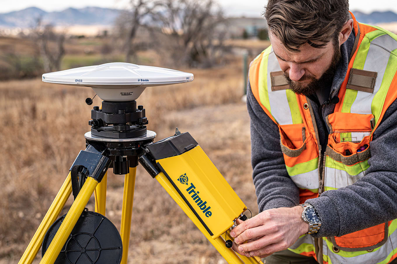 Surveyor in the field setting up Trimble R750 Model 2 base station
