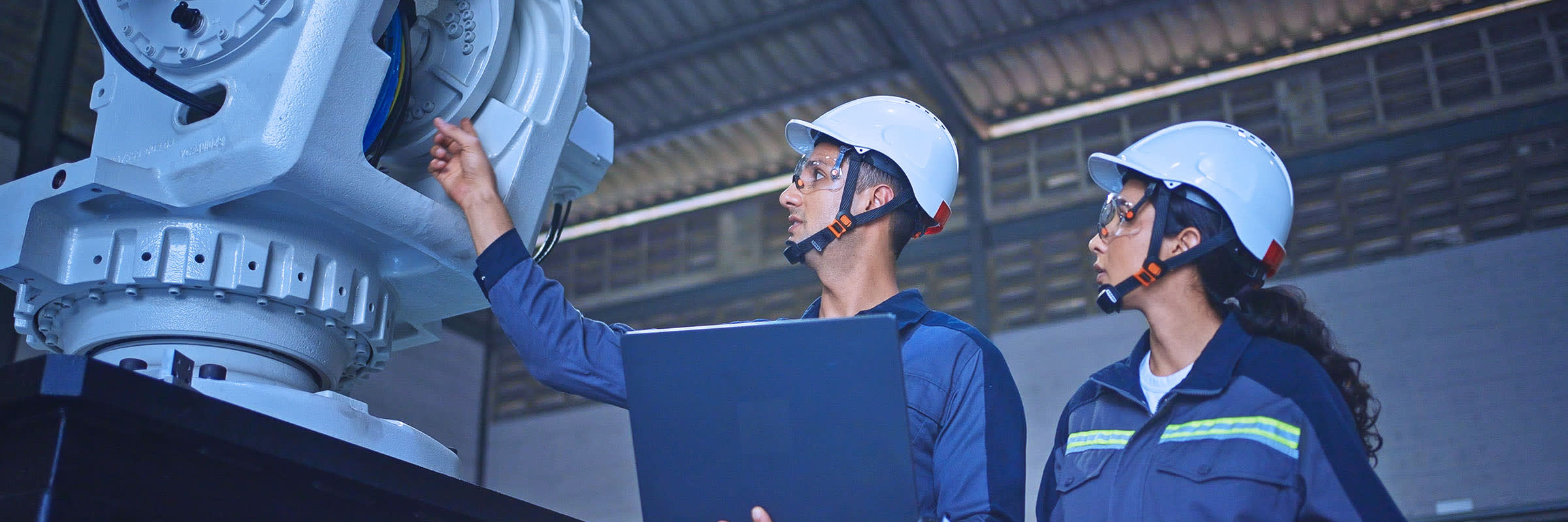 Employees in a manufacturing plant using IoT