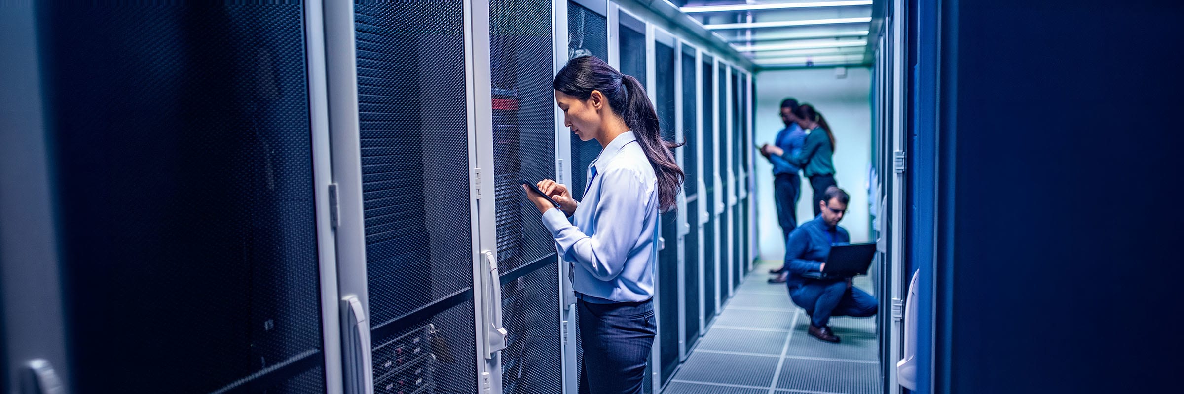 IT professionals collaborating on a comprehensive disaster recovery and business continuity plan.