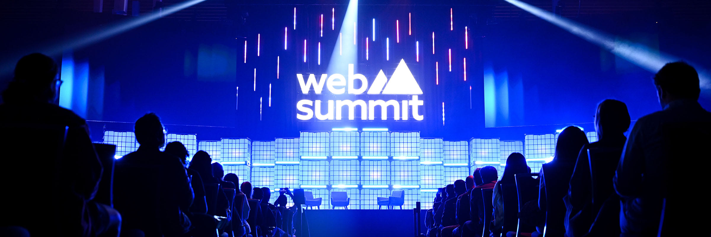 The main stage of Web Summit Vancouver is shown from the perspective of the audience. 