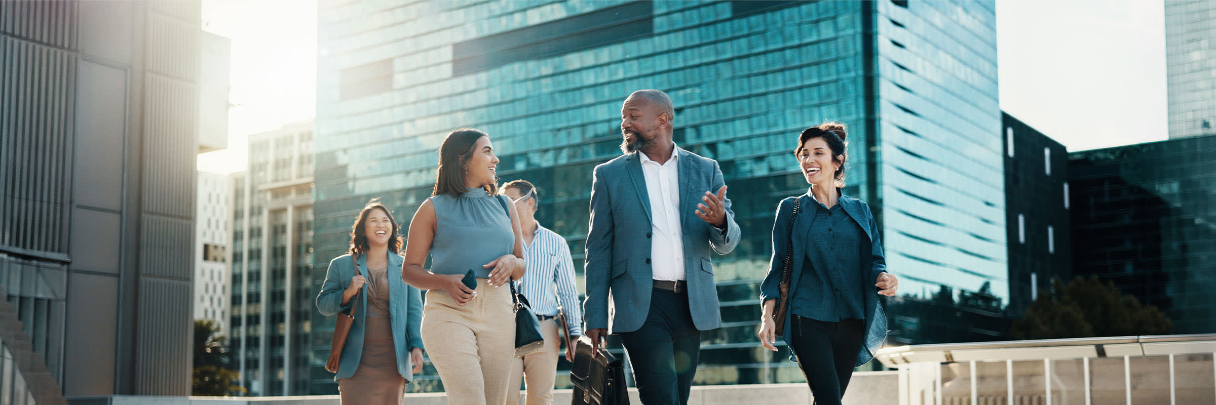 6 people walking to work smiling and interacting with one another