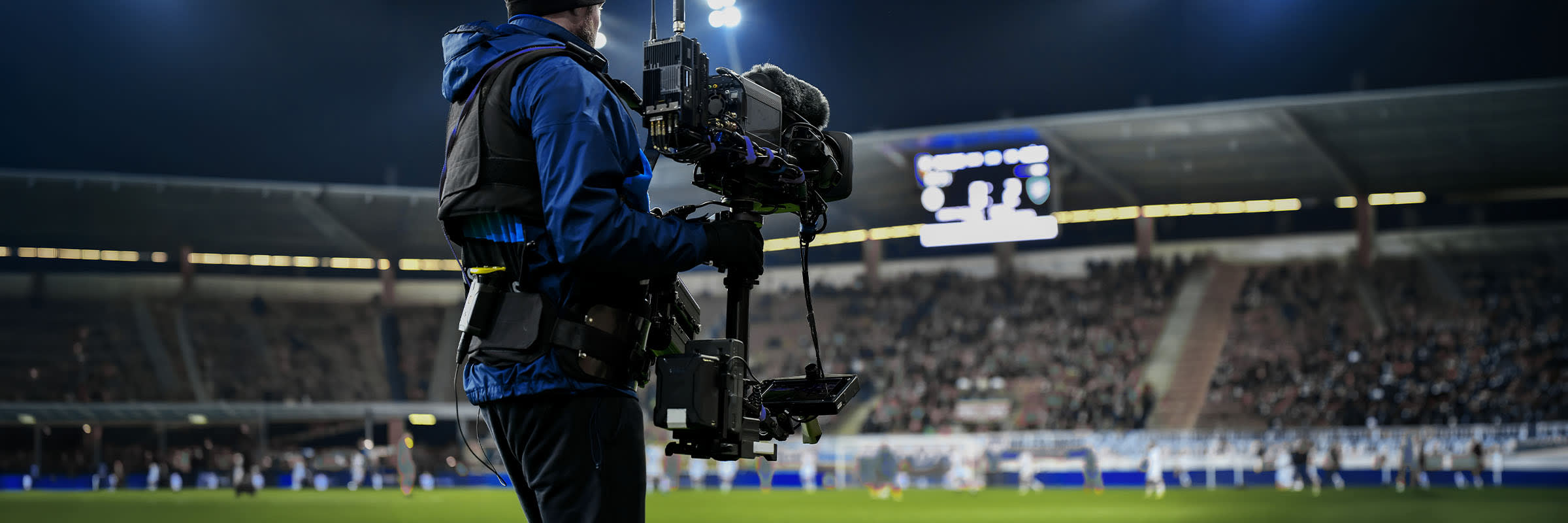 A camera operator films a live sporting event, powered by 5G network slicing.