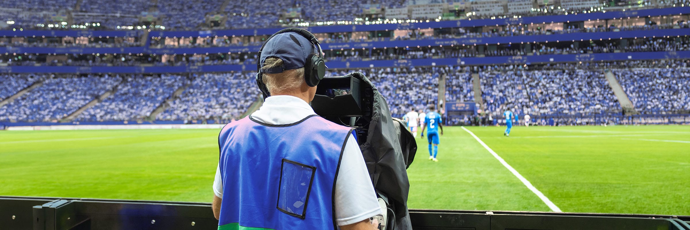 TSN camera crew using Bell 5G network slicing to broadcast live post-game interviews on the pitch during a major soccer tournament. 