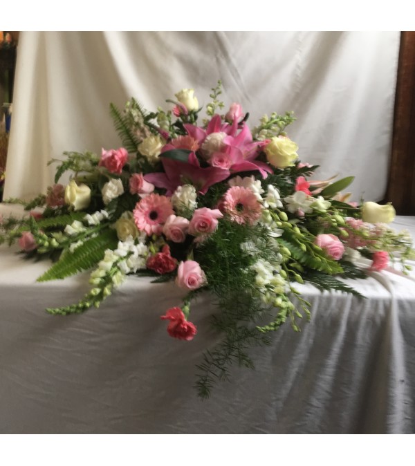 Pink and white casket cover