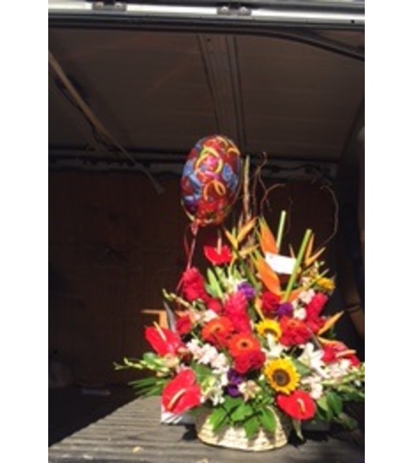 tropical arrangement in a basket