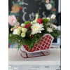 christmas sleigh flowers - Standard. An arrangement by Florist of the Northwoods.